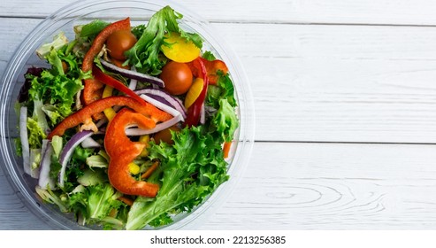 Overhead View Of Fresh Vegetable Salad In Glass Bowl Over Wooden Table, Copy Space. Unaltered, Veganism, Organic, Food, Healthy, Support, Vegan Day And Celebration Concept.