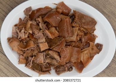 Overhead View Of Generous Portion Of Carnitas Pork Meat On A Plate Mixed With Roasted Peppers For A Full Flavor Meal.