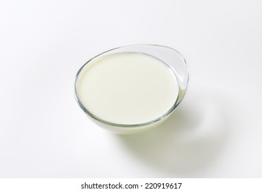 Overhead View Of Glass Bowl With Organic Milk