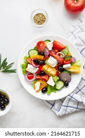 Overhead View Of Greek Salad On Light Surface Mediterranean Food