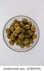 Overhead View Of Green Olives In Glass Bowl On Table