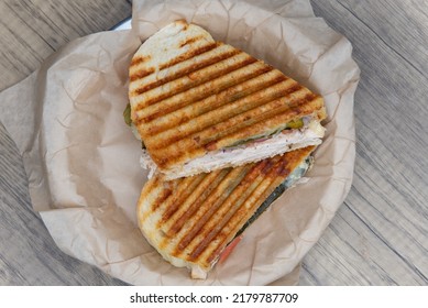 Overhead View Of Grilled Panini Sandwich, With Chicken And Mayo On Sour Dough Bread.