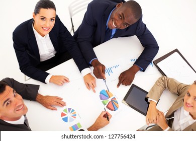 overhead view of group of business people having meeting together