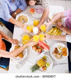 Overhead View Of Group Of People Having Breakfast