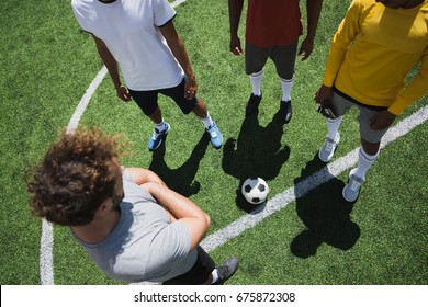 Overhead View Of Group Of Soccer Players During Soccer Match On Pitch