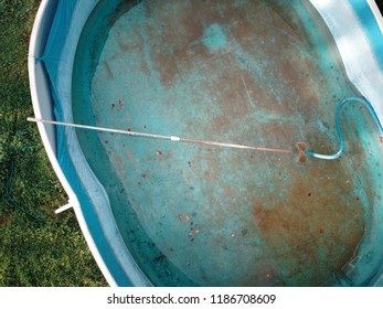 Overhead View Of A Half Empty Swimming Pool Needs To Be Cleaned