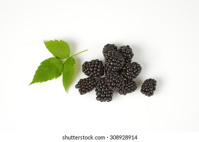 Overhead View Of Handful Of Blackberries And Leaves