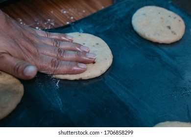 Overhead View Of The Hands Of An Adult Man Kneading Dough In A Table Wooden