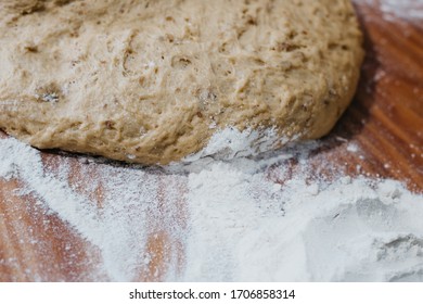 Overhead View Of The Hands Of An Adult Man Kneading Dough In A Table Wooden