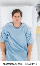 Overhead View Of Handsome Patient Lying In Hospital Bed