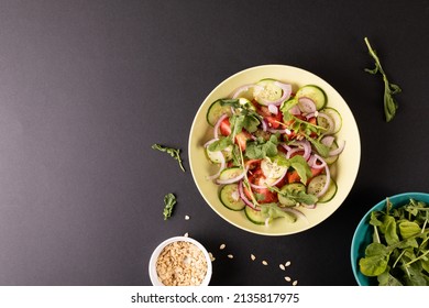 Overhead View Of Healthy Salad In Bowl On Black Background, Copy Space. Unaltered, Food, Studio Shot, Healthy Eating.