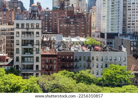 Overhead view of historic buildings crowded in Midtown Manhattan New York City as seen from the Roosevelt Island Tramway
