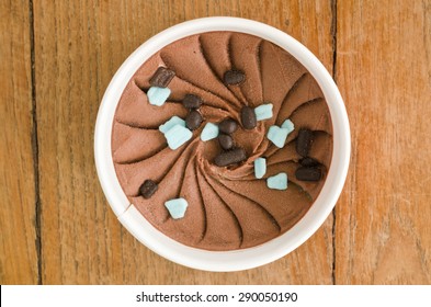 Overhead View Of  Homemade Chocolate Mint Italian Ice Cream Tub On Wooden Background