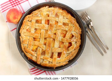 Overhead View Of Homemade Southern Peach Pie Decorated With Lattice Crust