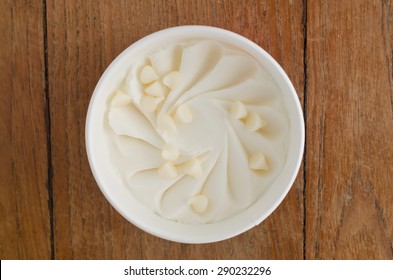 Overhead View Of  Homemade White Chocolate Italian Ice Cream Tub On Wooden Background