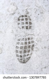 Overhead View Of Human Footprints On White Winter Snow Background.