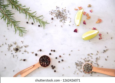 Overhead view of ingredients for cocktails on marble table 
