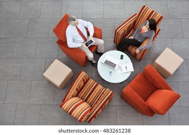 Overhead View Of Interview In Office Atrium