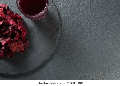 Overhead View Of Juice With Beetroot On Plate Over Slate