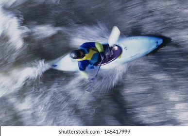 Overhead View Of A Kayaker Paddling Through Rapids