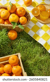 Overhead view of a light brown rectangular wooden crate filled with fresh ripe oranges. The inside surface of the oranges are juicy orange segments with white lines dividing them. Nature concept