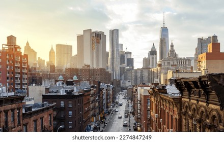 Overhead view of Madison Street in the Chinatown neighborhood of Manhattan with the downtown skyline buildings of New York City in the background