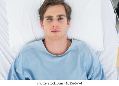 Overhead View Of Male Patient Lying In Hospital Bed