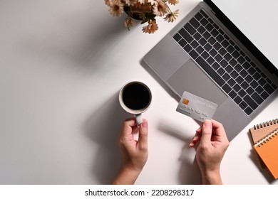 Overhead View Of Man Hand Holding Credit Card Front Of Laptop Computer. Online Shopping, E-commerce Concept