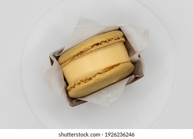 Overhead View Of Mango Macaron Ice Cream Sandwich Cookie With Very Sweet Flavor Makes Perfect Dessert After A Meal.