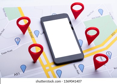 An Overhead View Of Map With Red Location Marker And Blank Display Mobile Phone