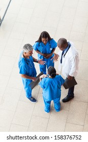 Overhead View Of Medical Workers Having A Meeting At Hospital