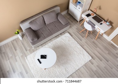 Overhead View Of Modern Living Room With Computer Desk And Sofa