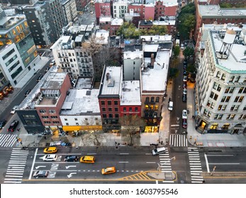 Overhead View Of New York City Street Scene With Taxis Driving Down Bowery Past The Buildings Of The Nolita Neighborhood In Manhattan NYC