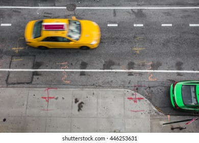 Overhead View Of New York City Street Scene With Yellow Taxi Cab And Green Car