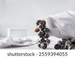 Overhead view of nigerian baba dudu candy on white background, top view of Ghana coconut candy or kube toffee candy, hard candy made with coconut milk and sugar on granite countertop