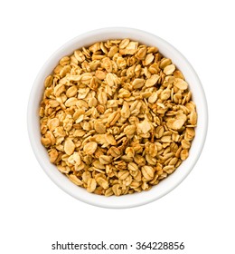 Overhead View Nutty Granola in a ceramic bowl. Rich in fiber and nutrition. The image is a cut out, isolated on a white background, with a clipping path.