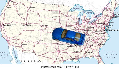 Overhead View On Blue Car Toy And United States Of America Road Map. - Image