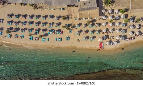 Overhead View Of Paradise Beach And Nearby Tropicana Beach Bar At Mykonos Island, Greece.