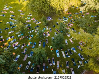 Overhead View Of People Do Yoga At City Public Park