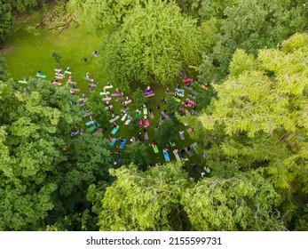 Overhead View Of People Do Yoga At City Public Park