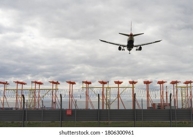 Overhead View Of A Plane Landing At Heathrow Airport On A Cloudy Day. London - 31st August 2020