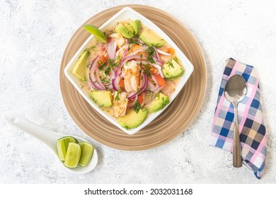 Overhead View Of A Plate Of Shrimp Ceviche With Avocado On A White Table