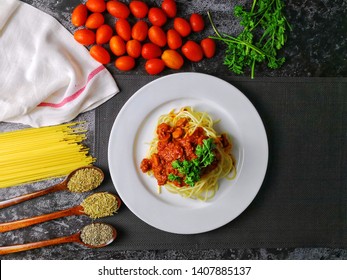 Overhead View Of A Plate Of Spaghetti With Ingredients. Flatlay