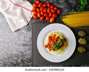 Overhead View Of A Plate Of Spaghetti With Ingredients. Flatlay