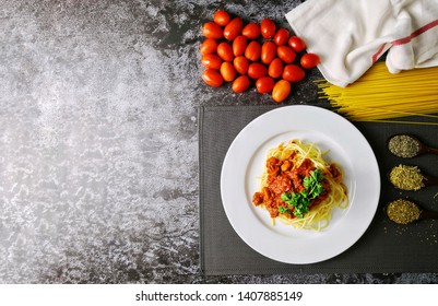 Overhead View Of A Plate Of Spaghetti With Ingredients. Flatlay