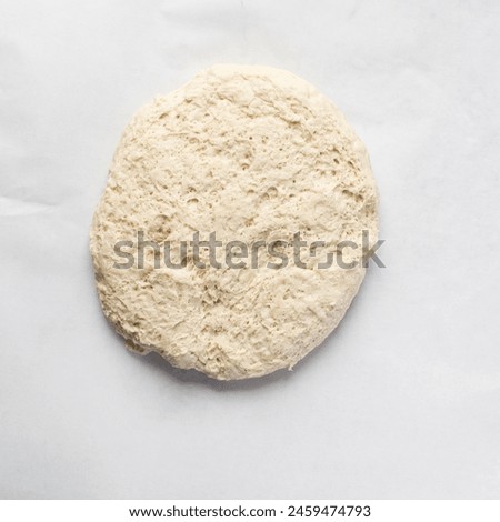 Overhead view of proofed bread dough with gluten structure, process of making homemade artisan bread