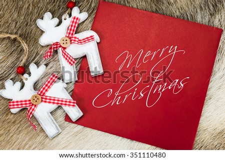 Overhead view of red envelope with written text 