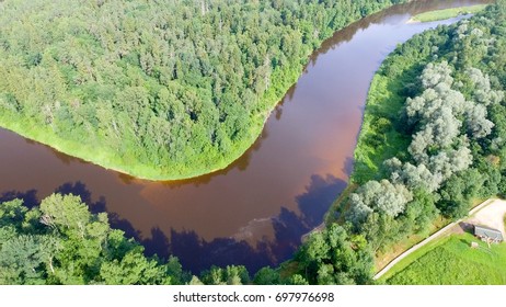 Overhead View Of River Across The Forest.