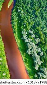 Overhead View Of River Crossing Beautiful Forest.