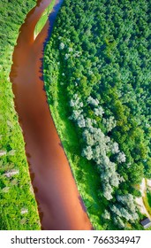 Overhead View Of River Crossing Beautiful Forest.